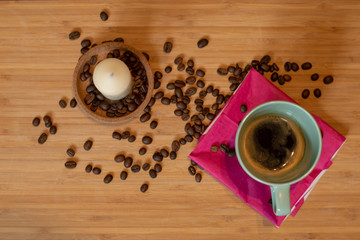 Espresso and coffee beans in background.