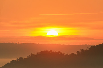 Heatwave hot sun. Climate Change. Global Warming.Beautiful landscape in the mountains at sunrise.Mountain Mist in sunrise,mist on sunrise,mist over mountain during sunrise