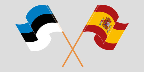 Crossed and waving flags of Estonia and Spain