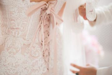White lace on the wedding dress close-up.