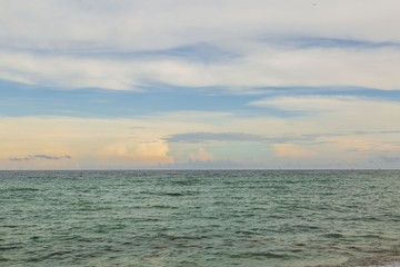 Gorgeous colorful view of turquoise water of Atlantic ocean and blue sky with white clouds. Miami Beach. Beautiful nature background.