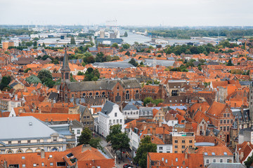 Naklejka na ściany i meble Panoramic view from the Belfort tower on the historic part of Bruges and the Cathedral of St. Salvator, the main pedestrian street with many shops, Belgium. Travel to Belgium.
