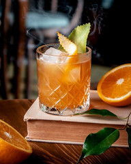 orange cocktail with ice on the table