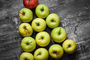 green apples on wooden table