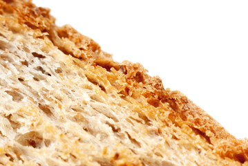 Macro photo of the texture of fresh wheat bread, a little toasted. Isolate on a white background.