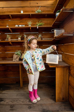 A young girl shopping at a arts and crafts market.