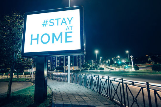 Stay At Home Campaign In Square Billboard Screen On The Street At Night