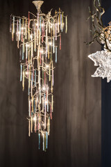 colored glass chandelier in a modern interior, chandelier like a tree, chandelier with glass drops