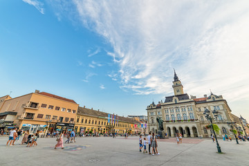 Obraz premium Novi Sad, Serbia July 30, 2019: Freedom Square (serbian: Trg slobode) is the main square in Novi Sad. The photo shows County government office (City house) and monument of Svetozar Miletic.