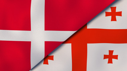 The flags of Denmark and Georgia. News, reportage, business background. 3d illustration