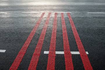 Red rumble strips on the road.