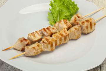 Grilled pork skewer served salad