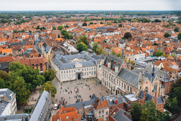 Obraz premium Panoramic view from the Belfort tower on the historic part of Bruges and the Cathedral of St. Salvator, the main pedestrian street with many shops, Belgium. Travel to Belgium.