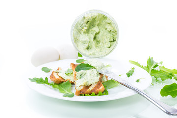 green bread spread of arugula, curds and eggs with fried toast