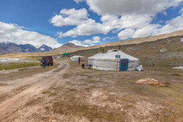 Mongolian dwelling on the green plain of grass.