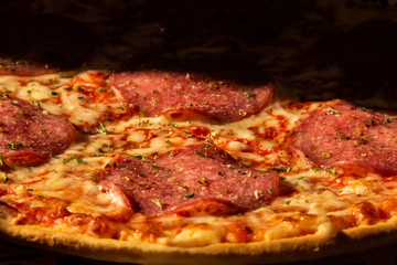 Close-up of a salami pizza