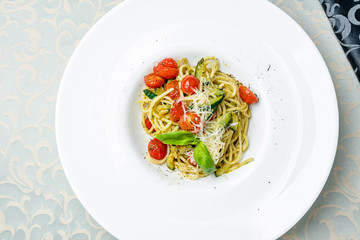 Spaghetti with vegetables with pesto sauce