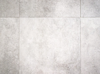 Grey, square cement floor tiles 