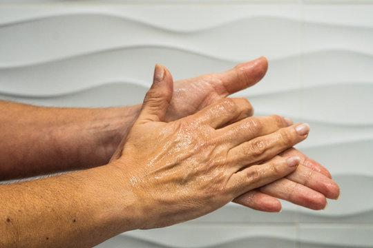 Hands washing with hydroalcoholic gel to prevent the spread of virus