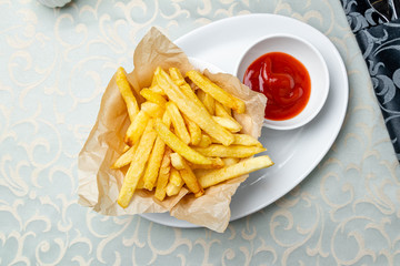 french fries on plate with ketchup