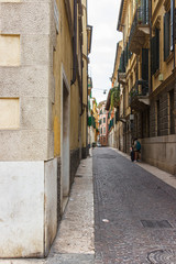The architecture of the old part of the city of Verona in Italy. The Vicolo Disciplina street.