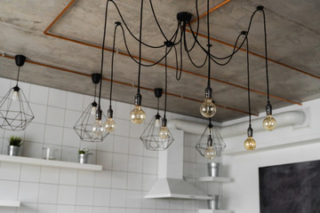 Lighting on a modern kitchen in comfortable apartment. Vintage luxury interior lighting lamp as a home decor.