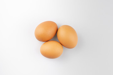 Overhead view of fresh brown chicken eggs.