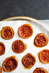 Candied orange slices on parchment paper