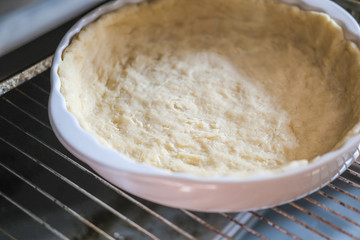 step by step visual instruction, ingredients to prepare salmon quiche tart. Homemade quiche with salmon and cheese. step 4, crust in baking tray