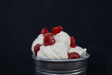 Vanilla ice cream with raspberry and strawberries