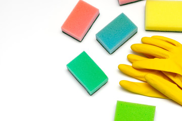 yellow rubber gloves and washcloths on a white background
