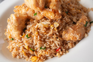 Peruvian seafood: chaufa de mariscos or rice with seafood Asian-style served on a white plate