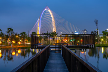 Nightscape of new landmark Konan Ai-Qin Bridge in Taichung City, Taichung Central Park at the Xitun District Shuinan Economic and Trade Area. The second largest park in Taiwan