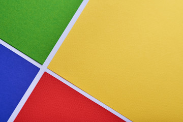 multi-colored minimalistic geometric paper background. Green, yellow, blue and red. pattern. it is...