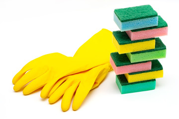 yellow rubber gloves and washcloths on a white background