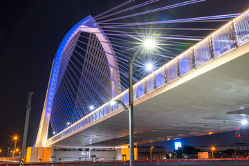 Fototapeta na wymiar Nightscape of new landmark Konan Ai-Qin Bridge in Taichung City, Taichung Central Park at the Xitun District Shuinan Economic and Trade Area. The second largest park in Taiwan
