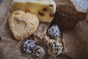 Handmade cheese with spices in the shape of hearts and balls.