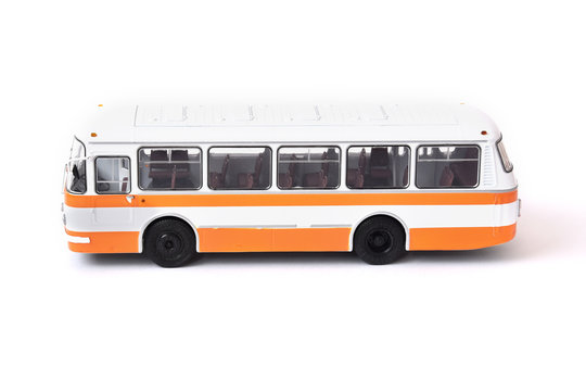 Scale model of a white yellow Russian bus. Toy yellow bus