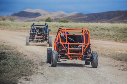 Buggy moves on a dirt dusty road