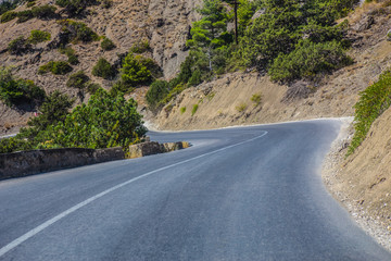 winding road in the mountains in summer