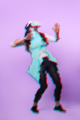 Fototapeta premium Woman is using virtual reality headset. Image with glitch effect.