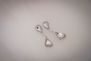 Close up of diamond earrings. space for your text.