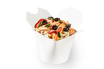 Savory wok noodle with seafood thin sliced of salmon. Black sesame seeds, olives and red bell pepper. White plain background food photography. Food container delivery takeaway space for text branding.