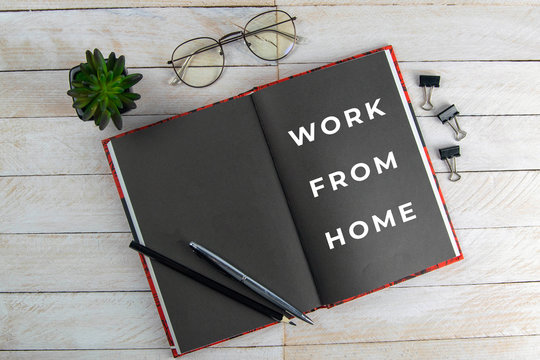 Covid 19 work at home concept. Pandemic Covid-19 Coronavirus quarantine concept. Mockup notebook for Covid19. Social distancing employee work at home to prevent virus infection in Covid-19 Outbreak