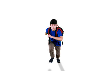 Fototapeta na wymiar Young student running with hat and rucksack