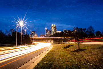 Long exposure photo of rush hour traffic zooming in and out of Raleigh, North Carolina.