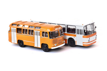 Scale model of a white and yellow Russian buses. Toy yellow bus