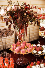 Festive table for newlyweds and guests. Dessert table for a wedding party