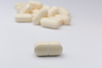 white pills practicing social distancing