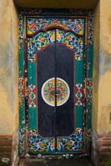 ancient wood door to house in Ubud on Bali
